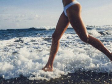 woman running in ocean