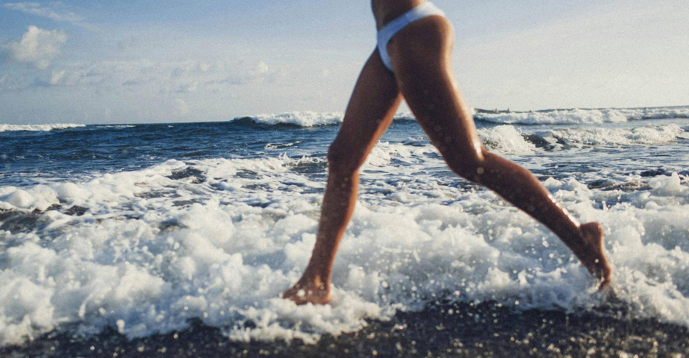 woman running in ocean