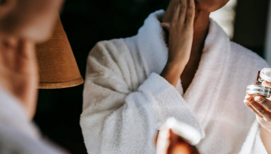 woman applying skincare cream